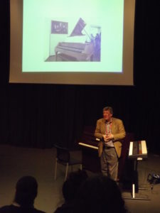 Professor john Irving giving a lecture